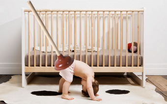 A plunger on a baby's butt
