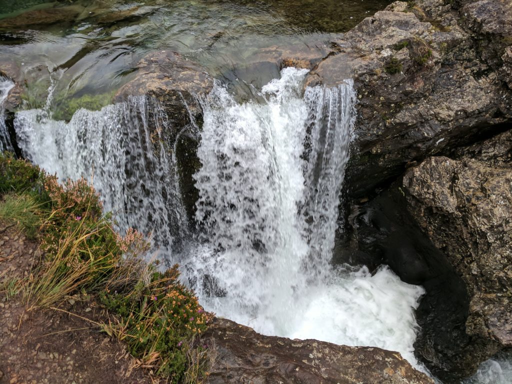 The beginning to the Some waterfalls along the trail at the Fairy Pools, the water cascading down falls from the pools